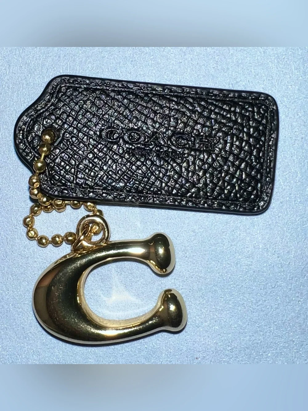 Coach black and Gold-Tone 'C' Pendant Keychain with Black Leather Tag